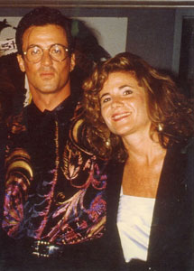 Art Brokerage broker Jennifer Walker and Sly Sylvester Stallone at his opening show in Beverly Hills 1991